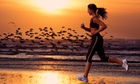 woman running on the beach